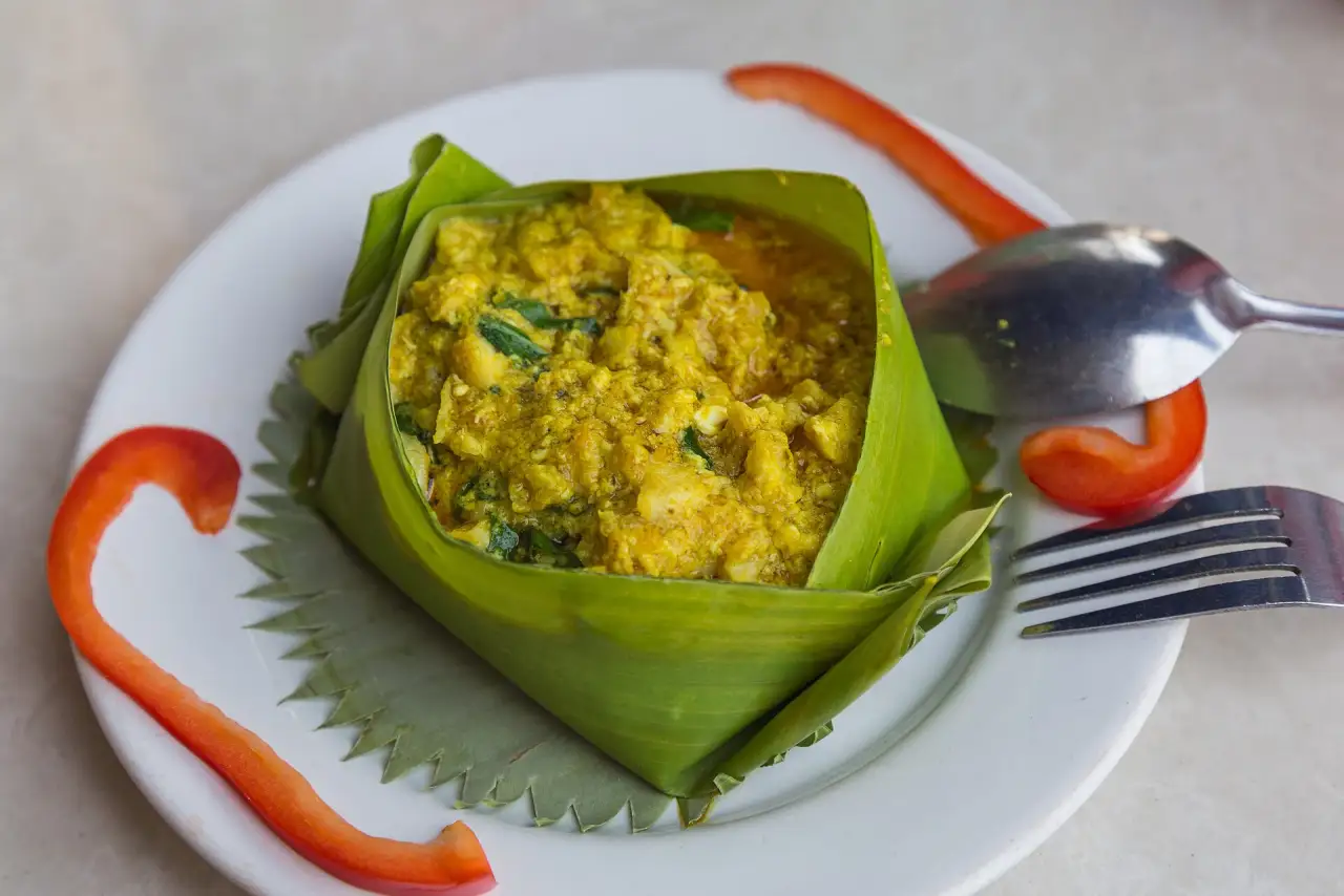 Fish amok served in a banana leaf cup