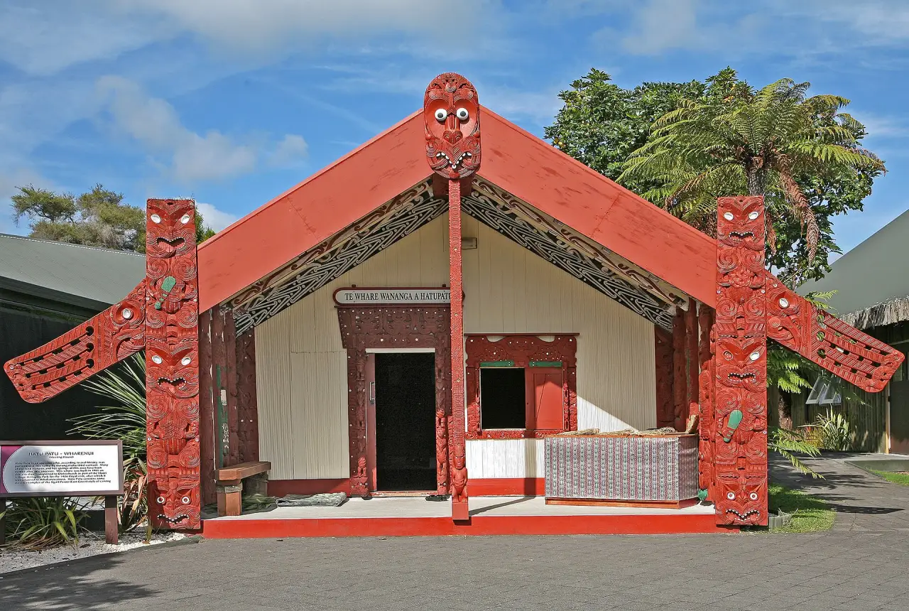 A carved Māori meeting house (wharenui)
