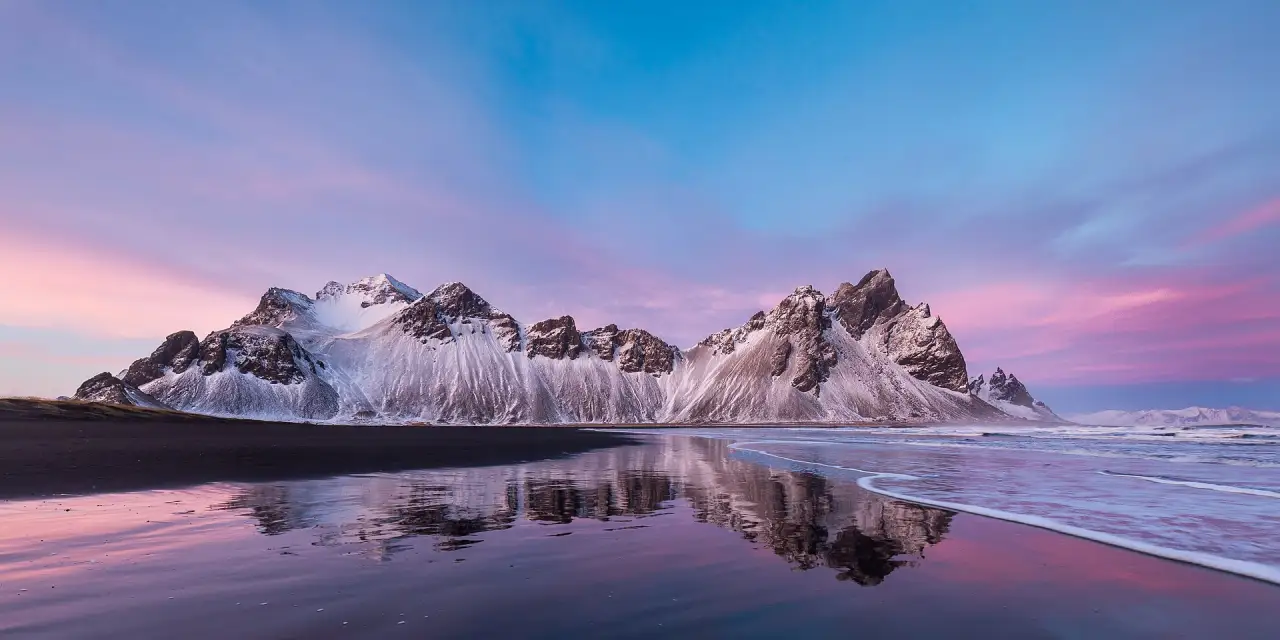 Vestrahorn mountain above the black dunes of Stokksnes Vestrahorn mountain above the black dunes of Stokksnes