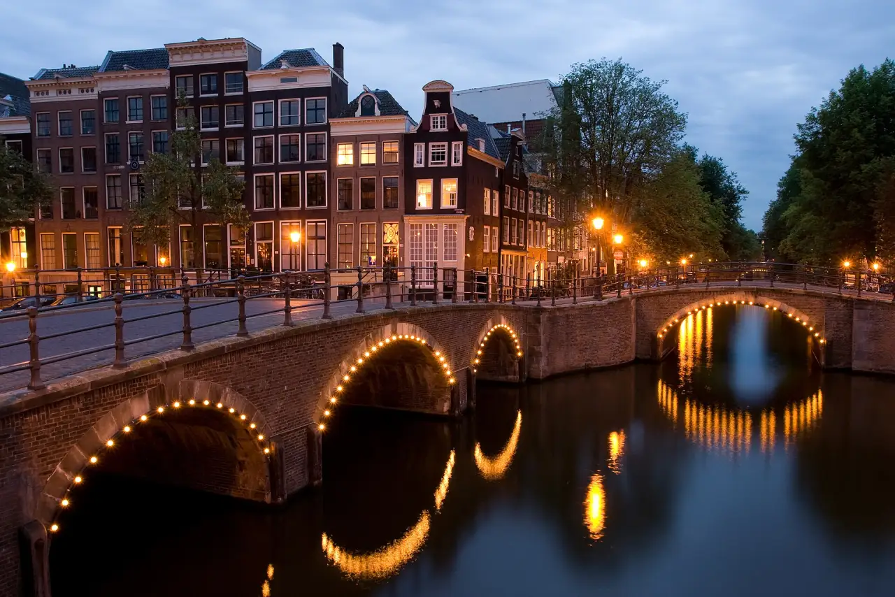 A canal bridge lit at night, Amsterdam