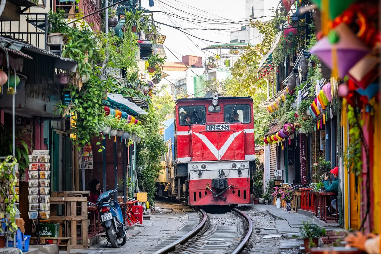 A train squeezing through Hanoi's Train Street